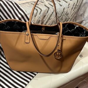 Henri Bendel cognac colored tote bag
17 inches wide 12 inches high